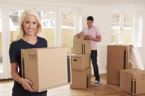 Moving van and packed boxes for a local home removal in Emersonpark