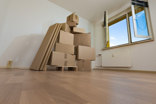 Careful loading of boxes and household goods into a van in Emersonpark