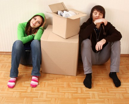 Staff using safe methods to move items through a property