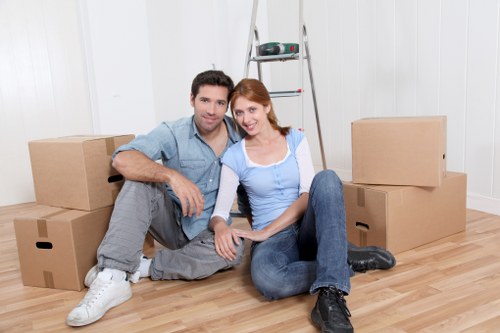 Items being carefully loaded into a removal van for transport