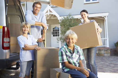 Packed boxes and furniture ready for transport during a move